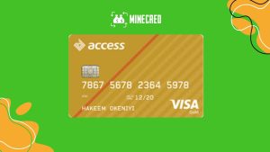 A hand holding the Acess Bank Visa Gold card, featuring a sleek gold design with diagonal stripes, a chip, and the Visa logo.