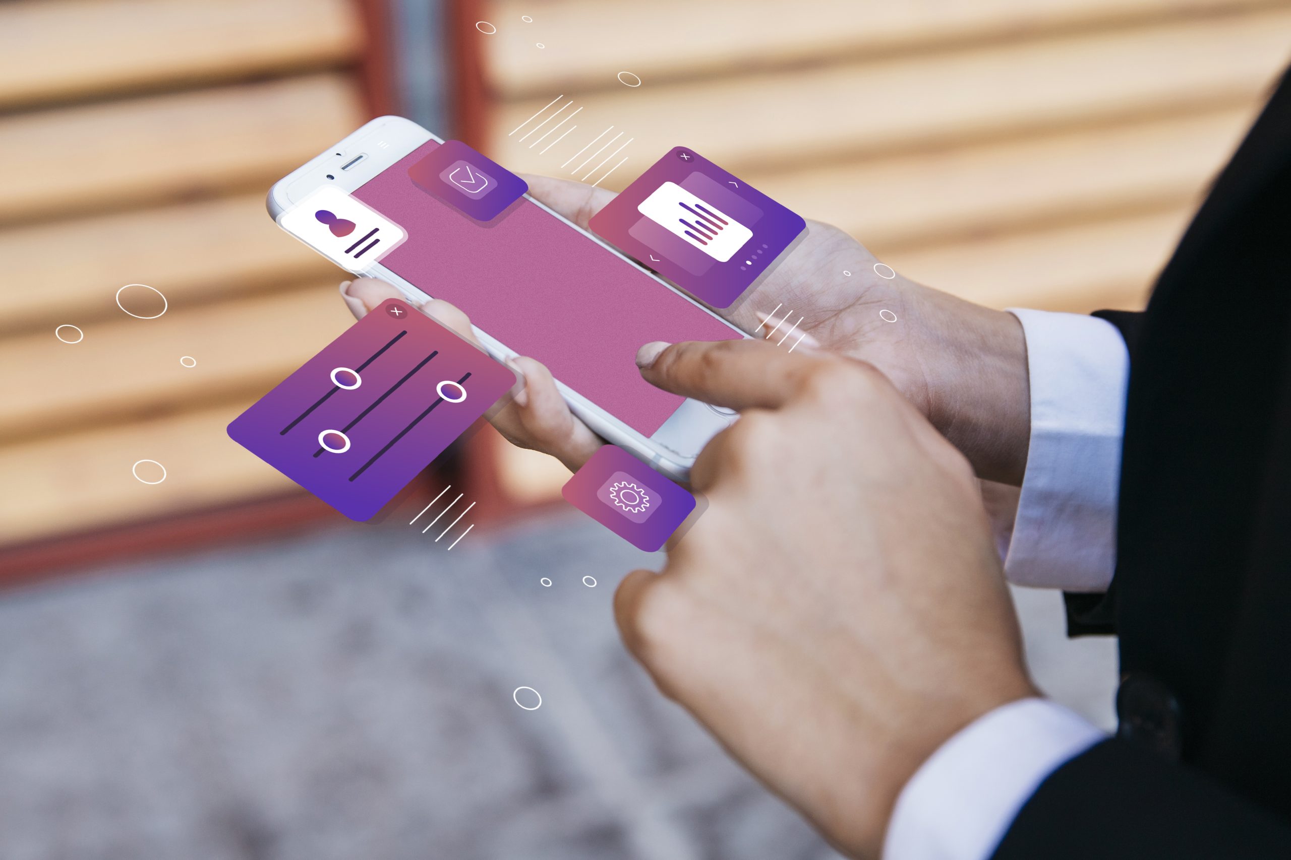 A person interacting with a smartphone displaying floating financial app icons, representing the use of digital cards for secure and innovative mobile payments.