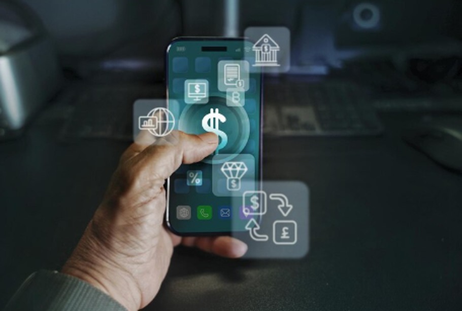 A hand holding a smartphone displaying various financial icons, representing the growing influence of digital banks and fintech applications in mobile banking services.